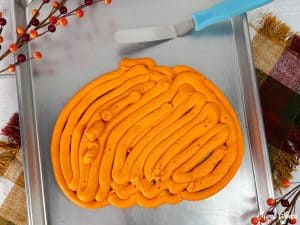Pumpkin shaped frosting on tray