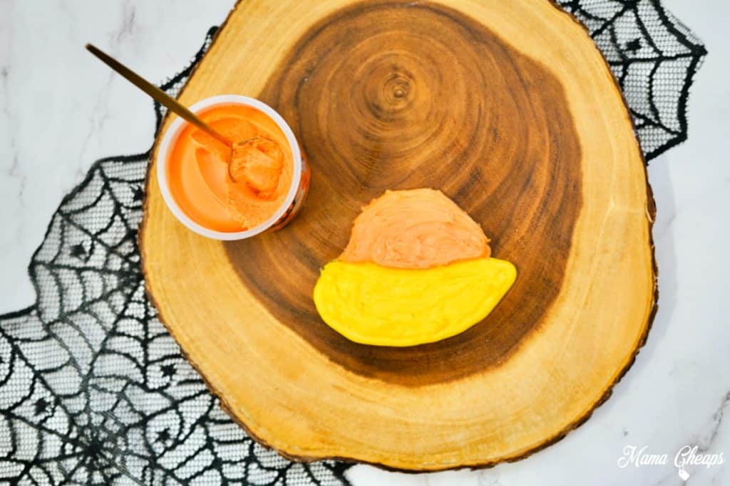 Orange frosting on candy corn board